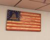 American Flag with coiled snake embedded in the stars hanging on a wall