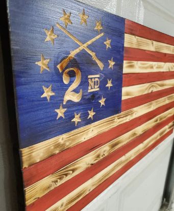 American flag with colonial stars and crossed rifles and 2nd in the stars