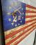 American flag with colonial stars and crossed rifles and 2nd in the stars