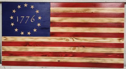 Carved colonial style flag featuring 1776